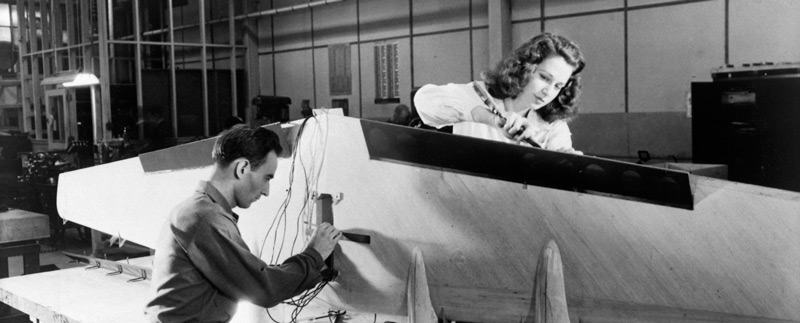 Flying Boat Construction Description Technicians at Langley installing flaps and wiring on a flying-boat model, circa 1944.