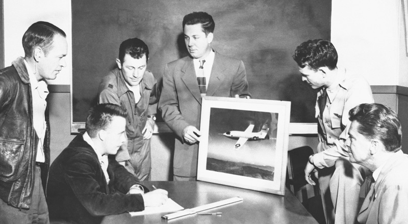 Key members of the XS-1 Research Team NACA Muroc Flight Test Unit XS-1 Team members and USAF Pilots. From Left to Right: Joseph Vensel, Head of Operations; Gerald Truszynski, Head of Instrumentation; Captain Charles Chuck Yeager, USAF pilot; Walter Williams, Head of the Unit; Major Jack Ridley, USAF pilot; and De E. Beeler, Head of Engineers. (Image # E95-43116-5)